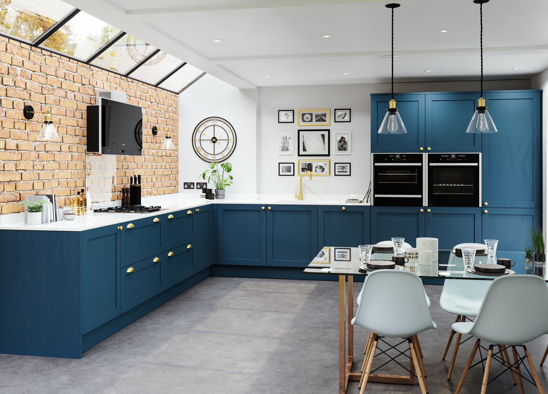 Modern blue kitchen with brick accent wall, white countertops, gold hardware, and dining table.
