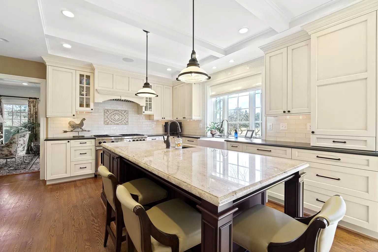 Knoxville Kitchen design with white cabinets and a large island in the middle . 