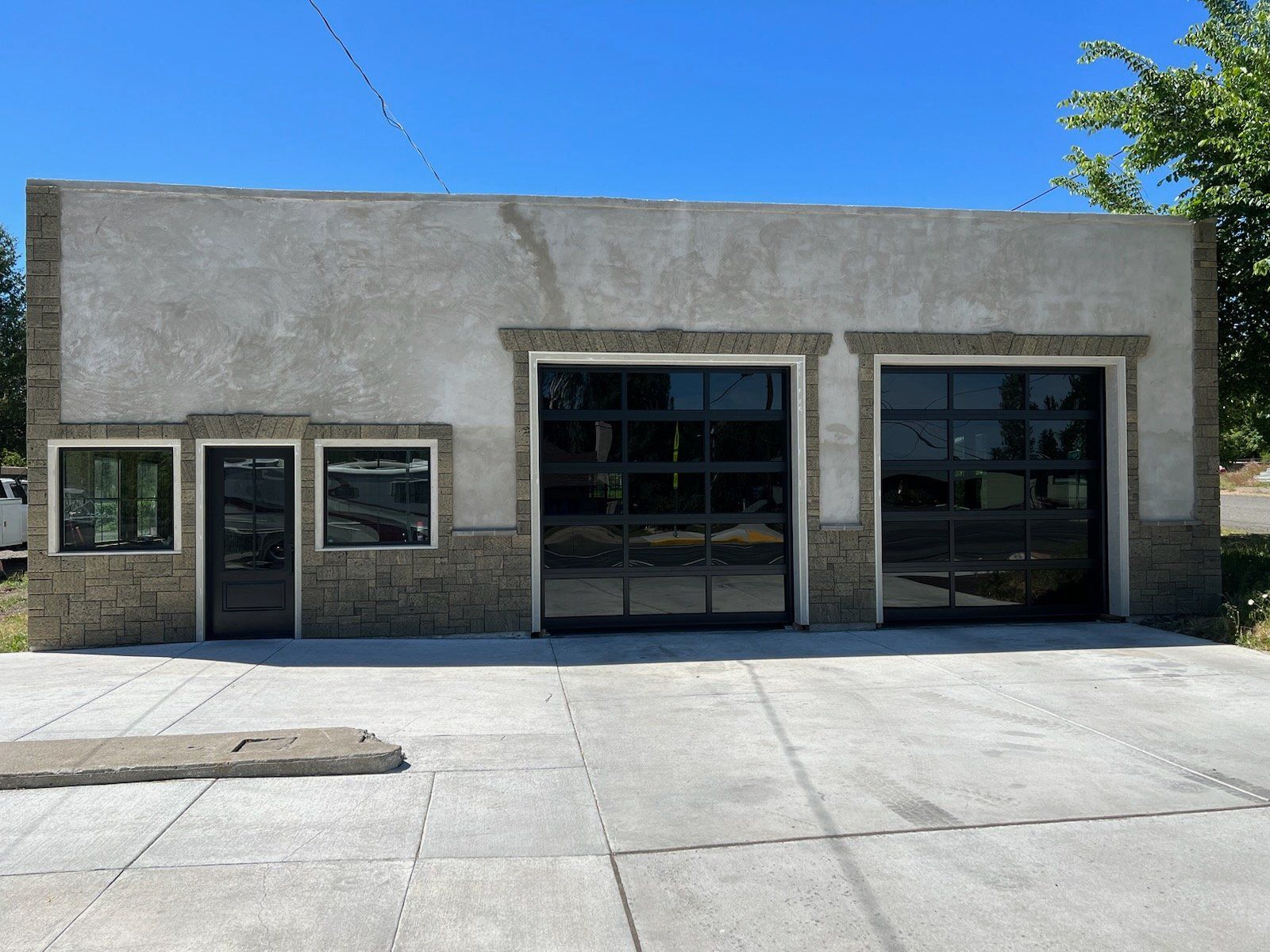 A building with a lot of windows and garage doors