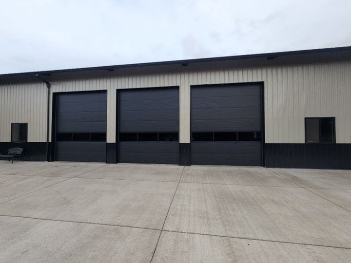 A building with a lot of black garage doors