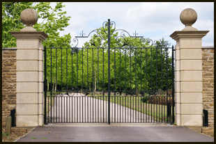 black iron gate with pillars either side