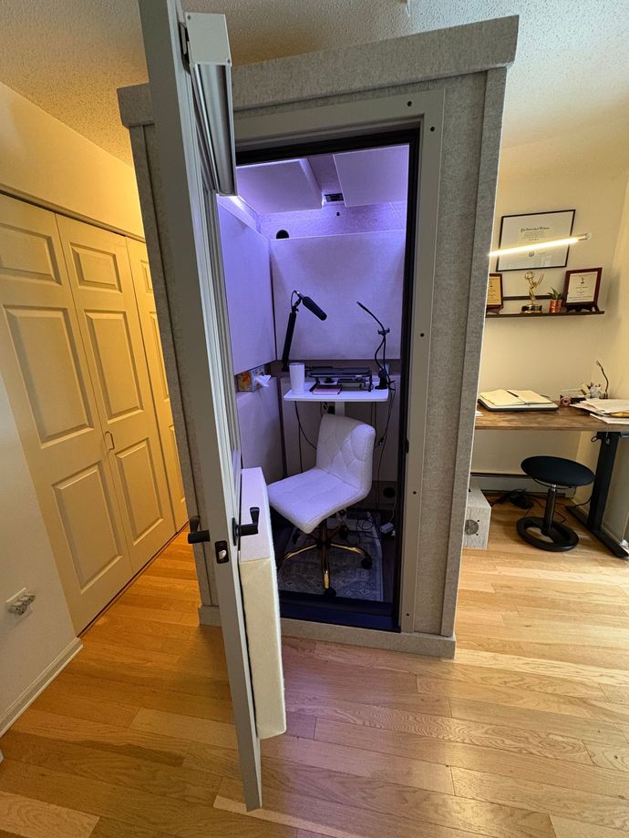 Photo of sand-colored premium, double-walled LA Vocal Booth inside home studio.
