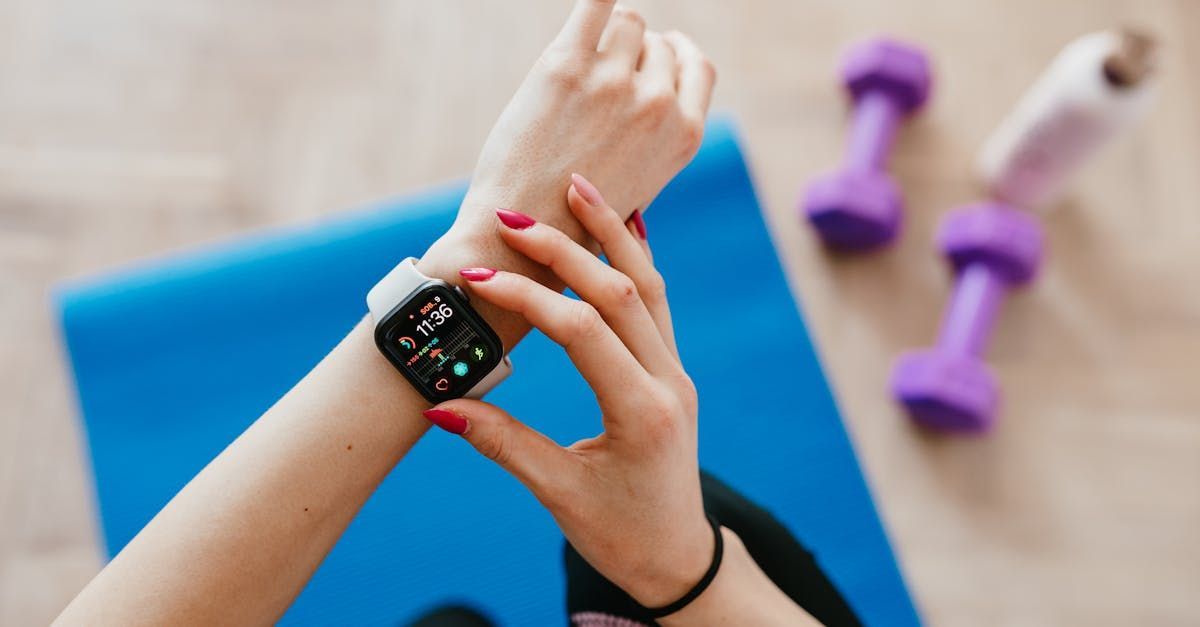 A woman is wearing a smart watch on her wrist.