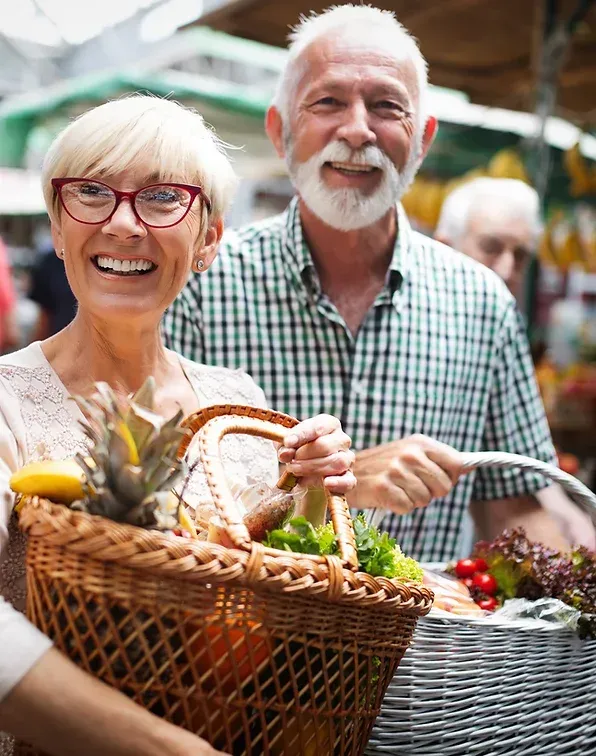 two elderly people shopping