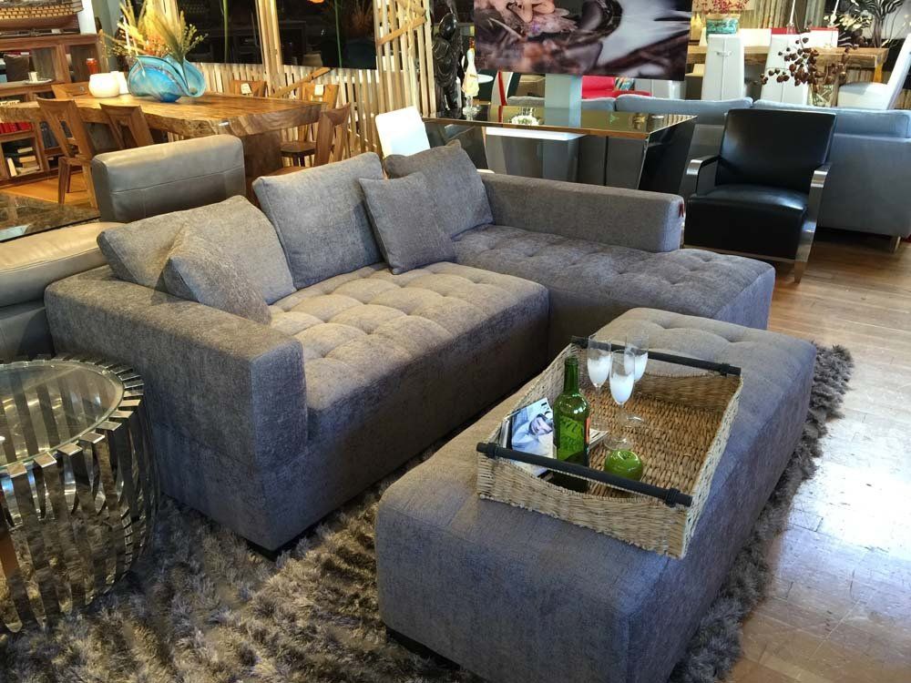gray sectional couch with ottoman