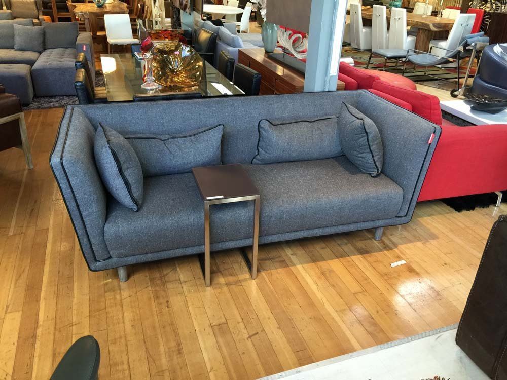 dark gray couch with metal table
