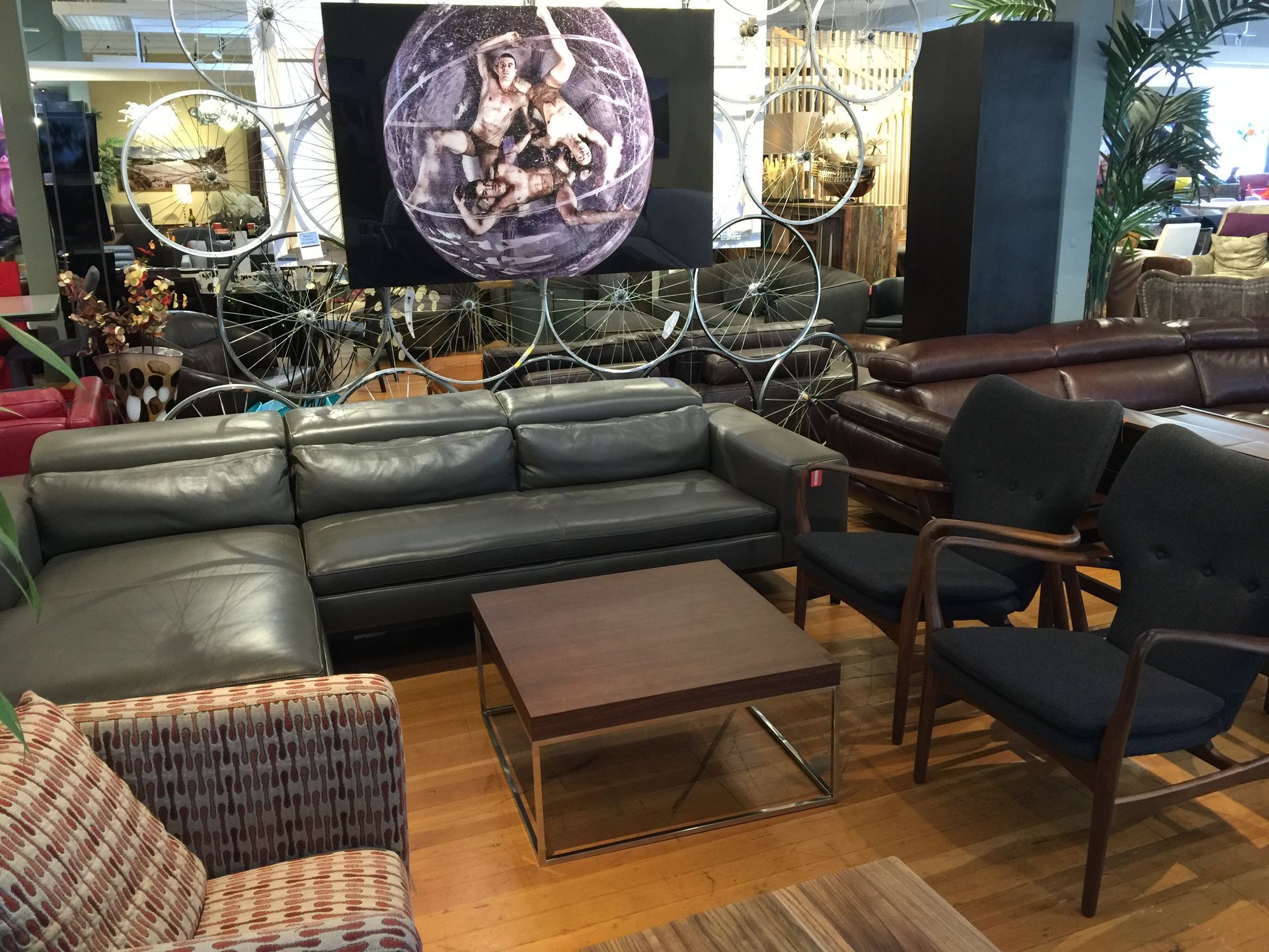 gray leather couch and modern end chairs