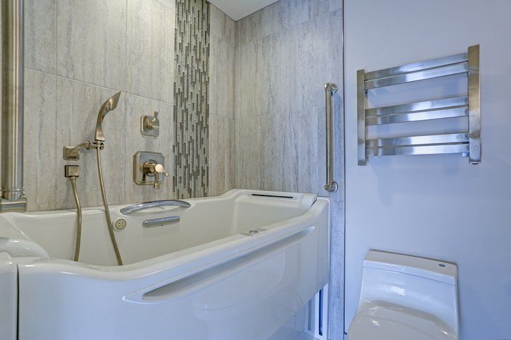 Bathroom — Bath Tub with a Transfer Bench in Church Road
