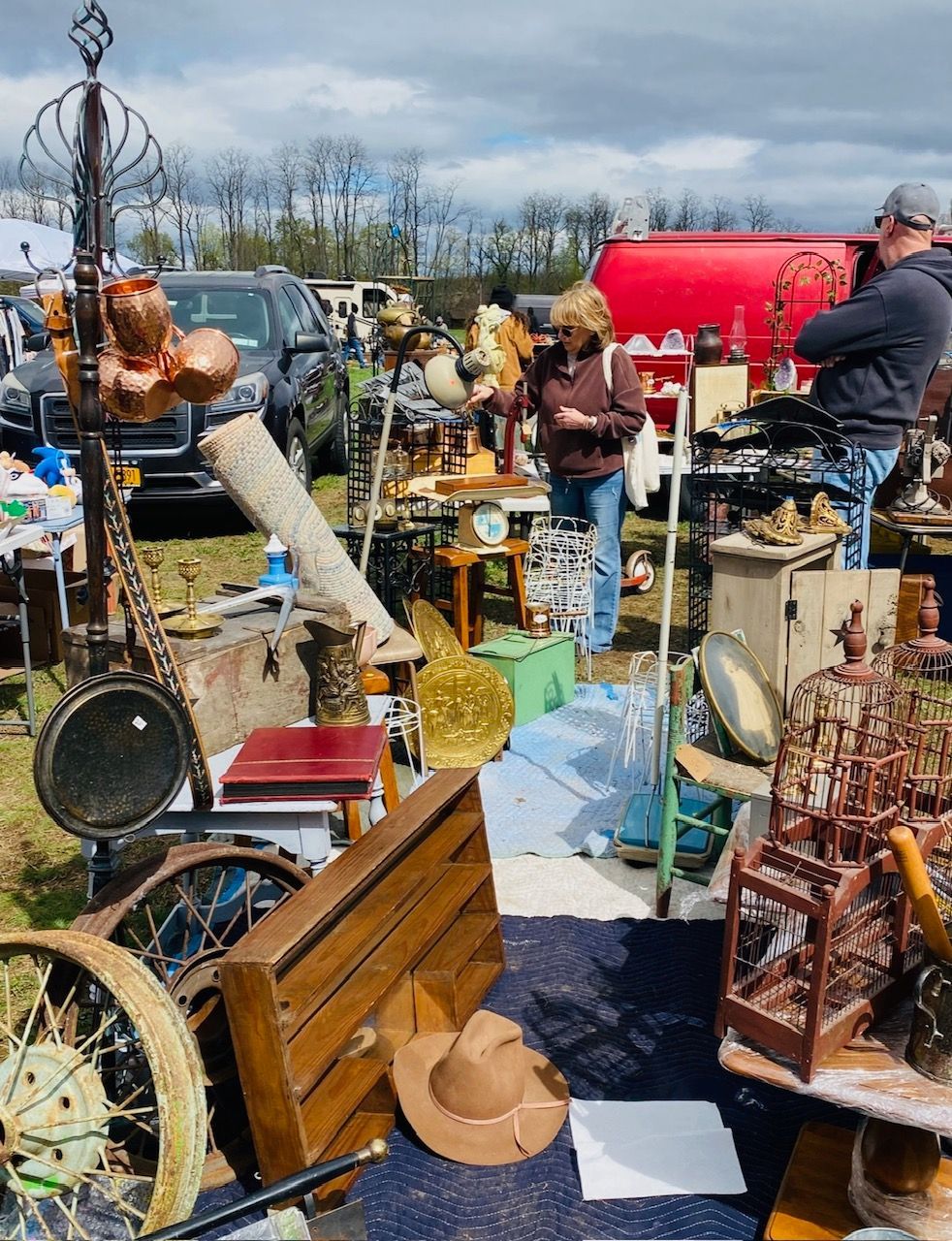 A bunch of antique items are on display at a flea market