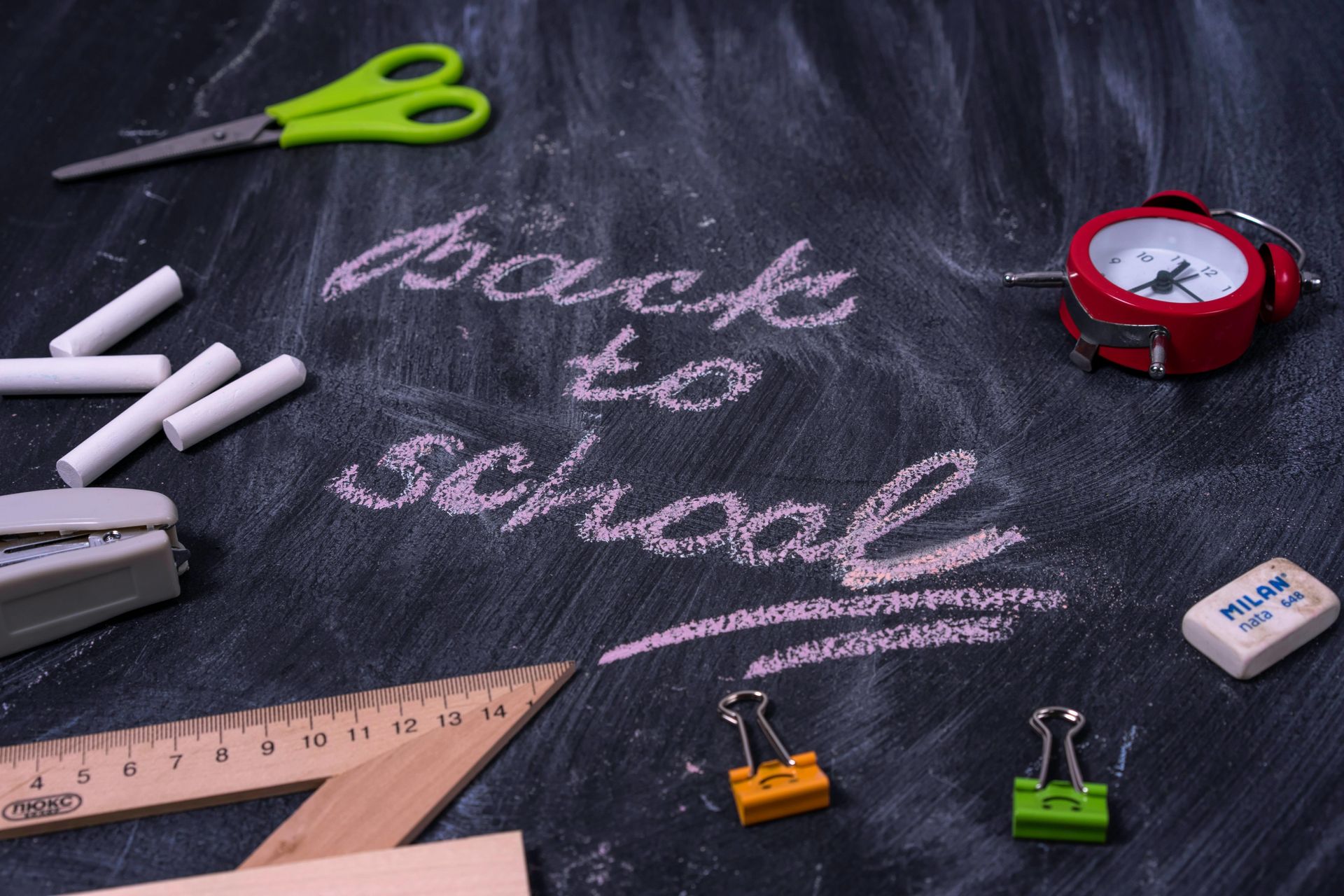 A blackboard with the words back to school written on it