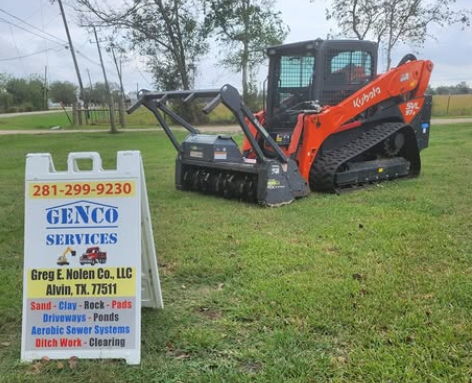A Kubota skid steer with a mulcher attachment and a GENCO SERVICES sign in Alvin, TX.