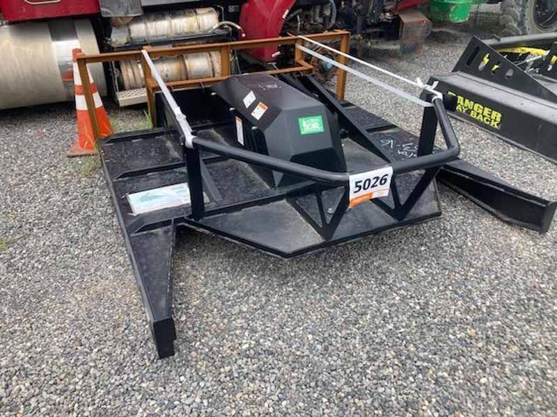 Black commercial-grade brush mower with a safety cage.