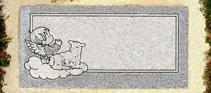 Gravestone with an angel and lamb carving. The blank space in the middle is for text.