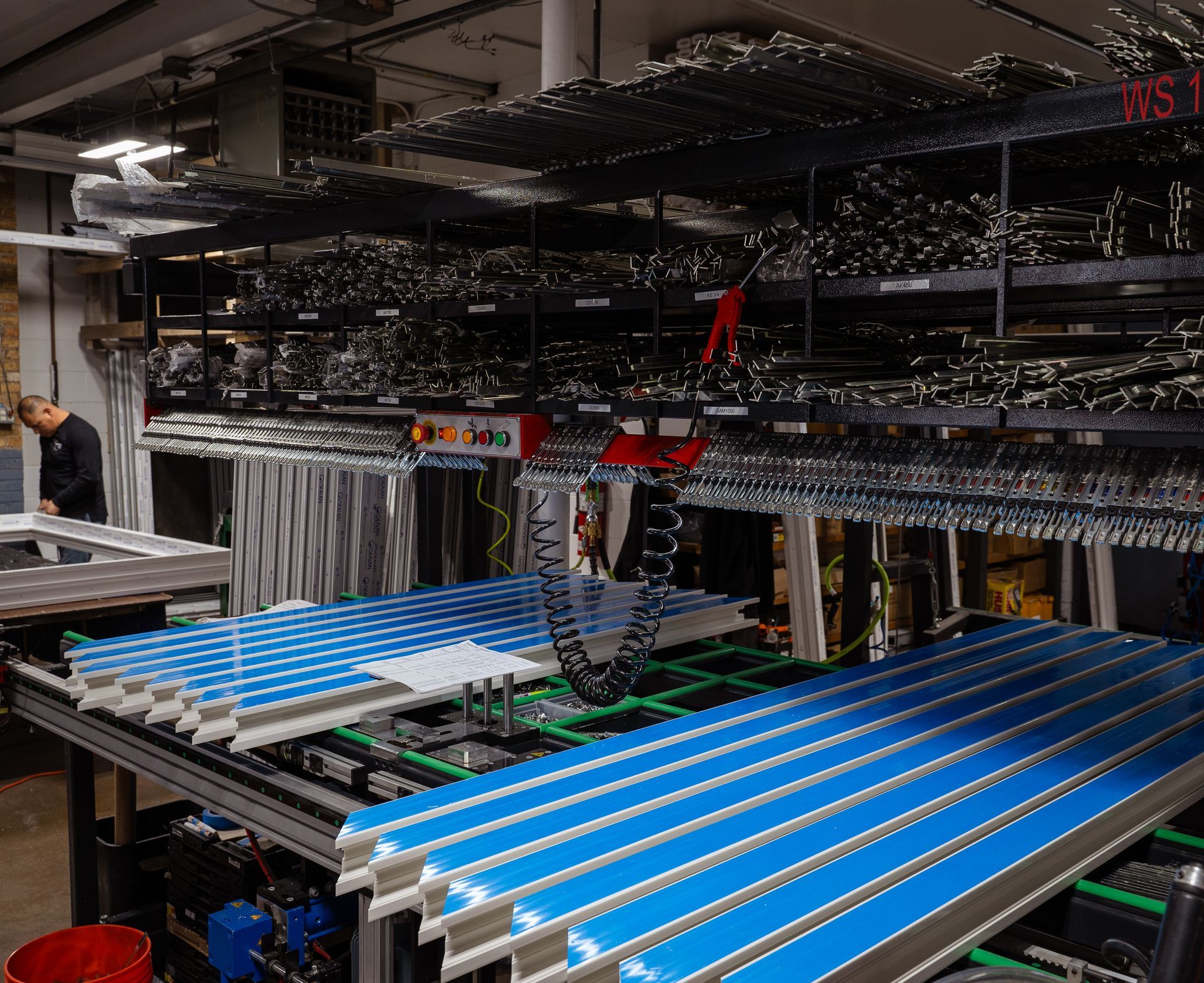 A warehouse filled with lots of blue and green pieces of metal