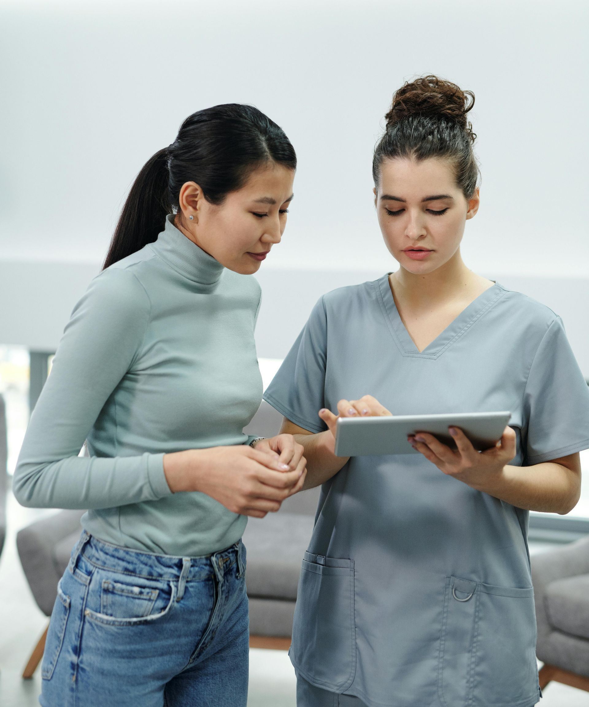 Medical Office Staff conversing with a patient. 
