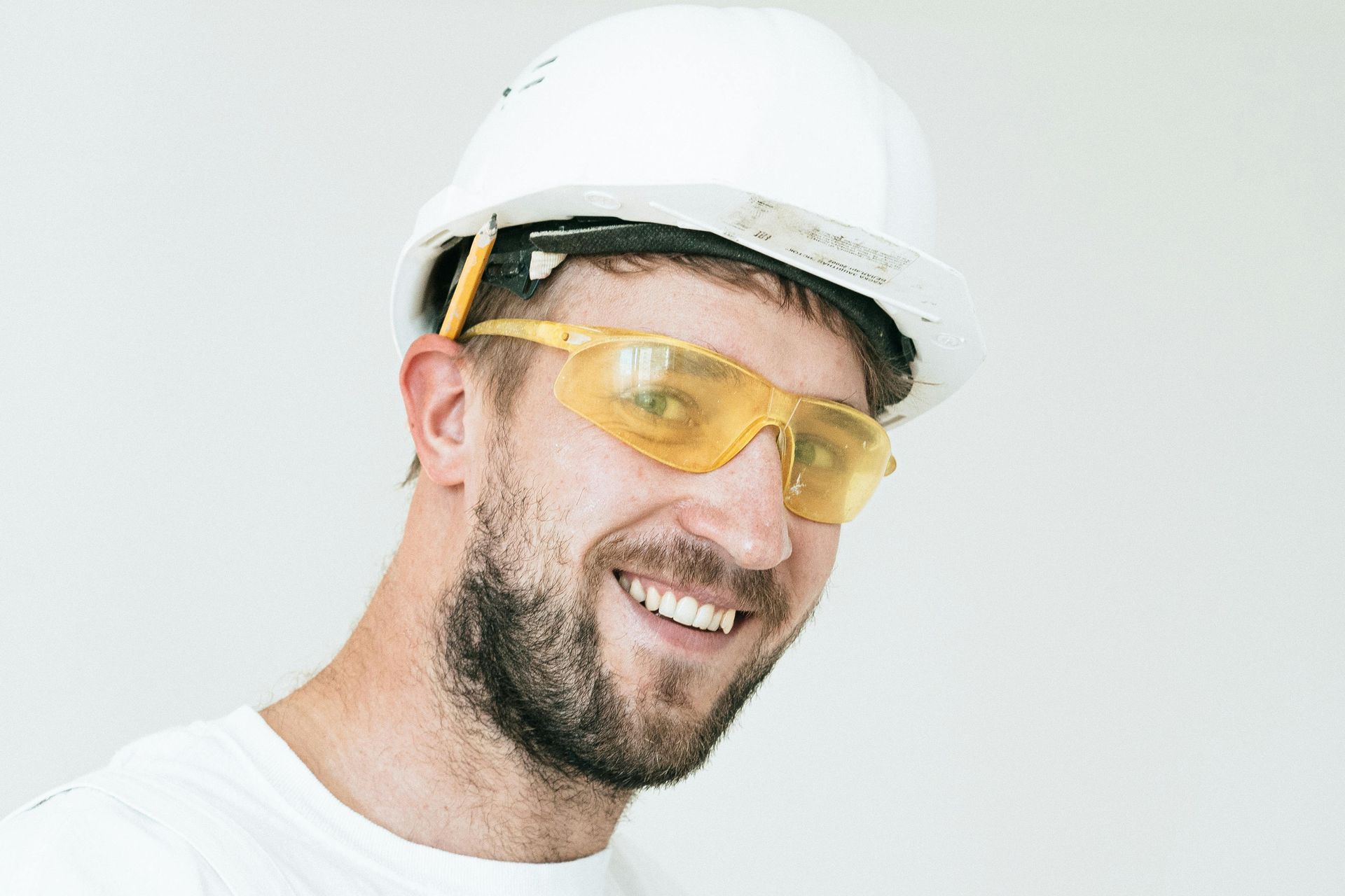 happy contractor with hardhat and goggles