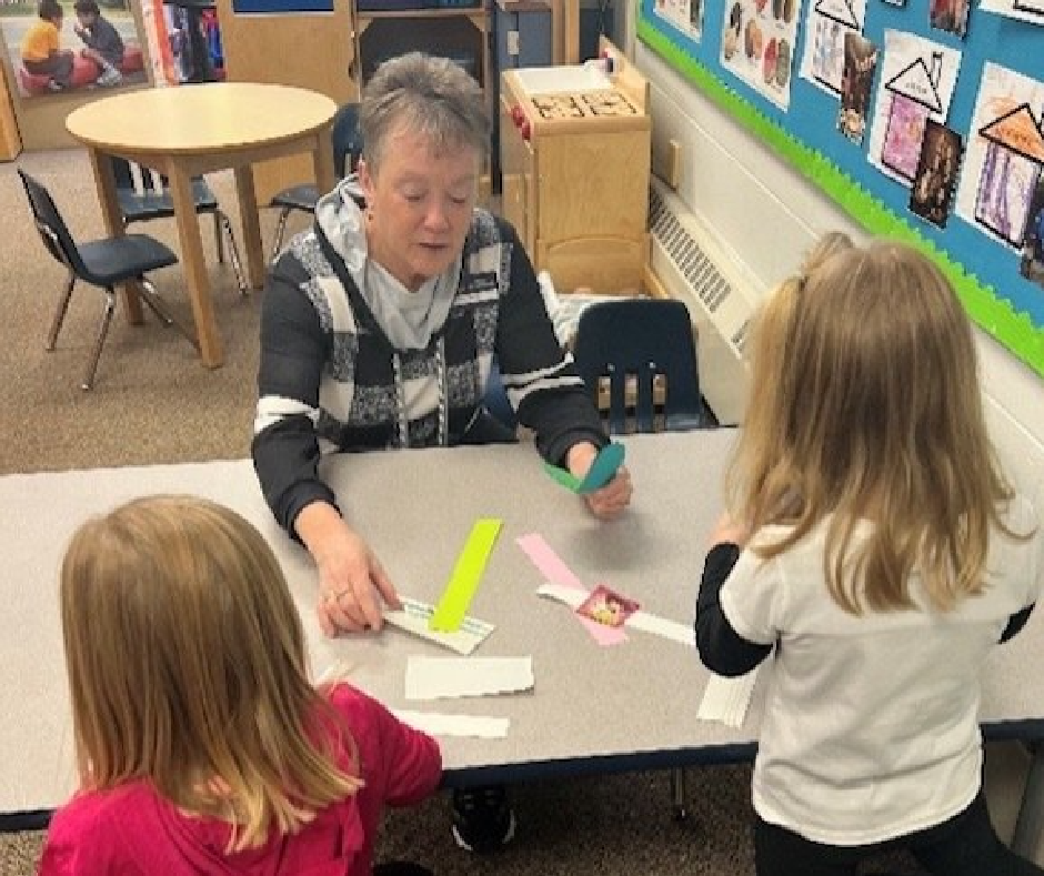 Grandma Audrey Dingmann working with students. 