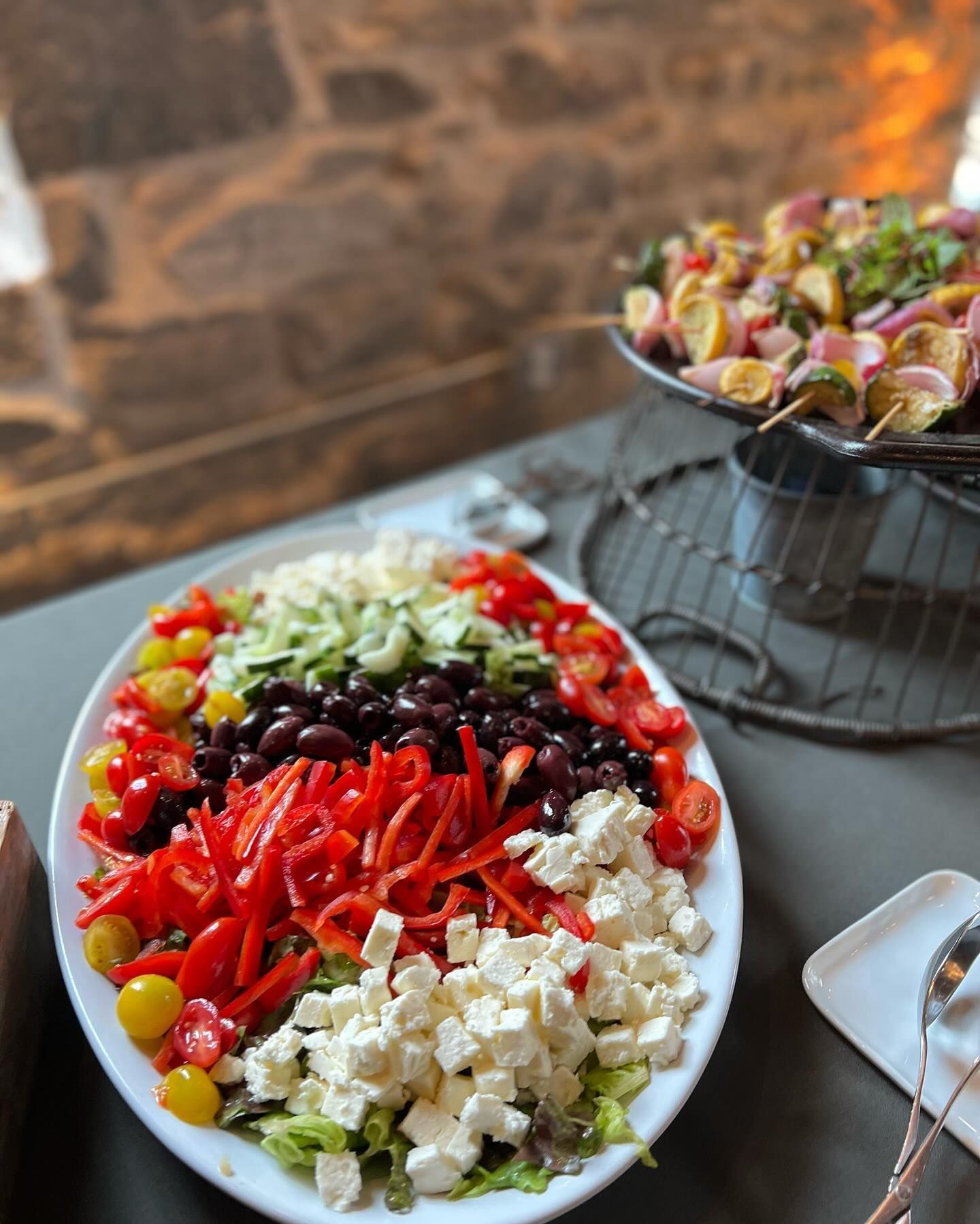 Lunch Catering in Baltimore, MD by Copper Kitchen where the served Greek meze ingredients and side skewers, indoors.