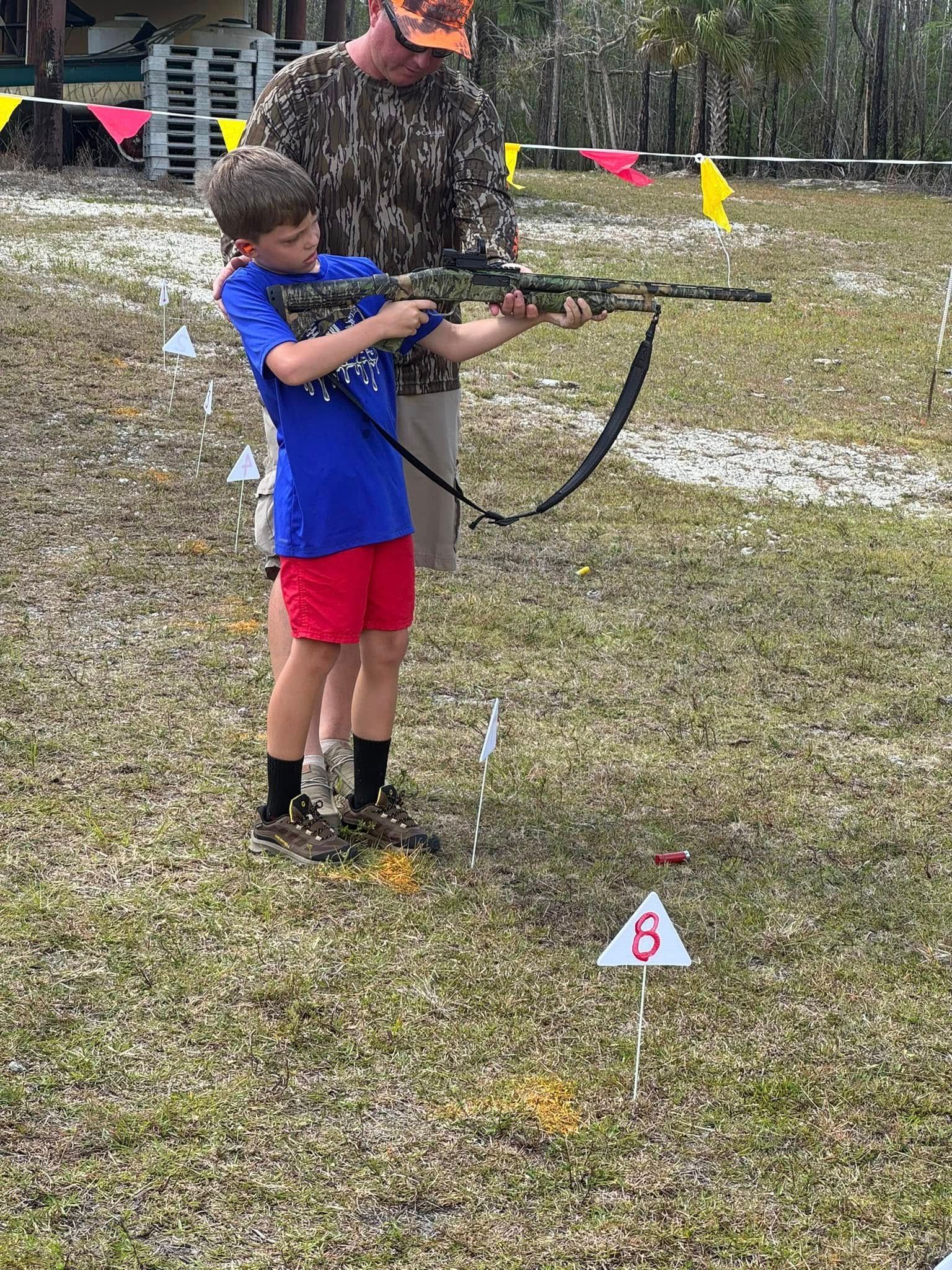 child shooting a gun