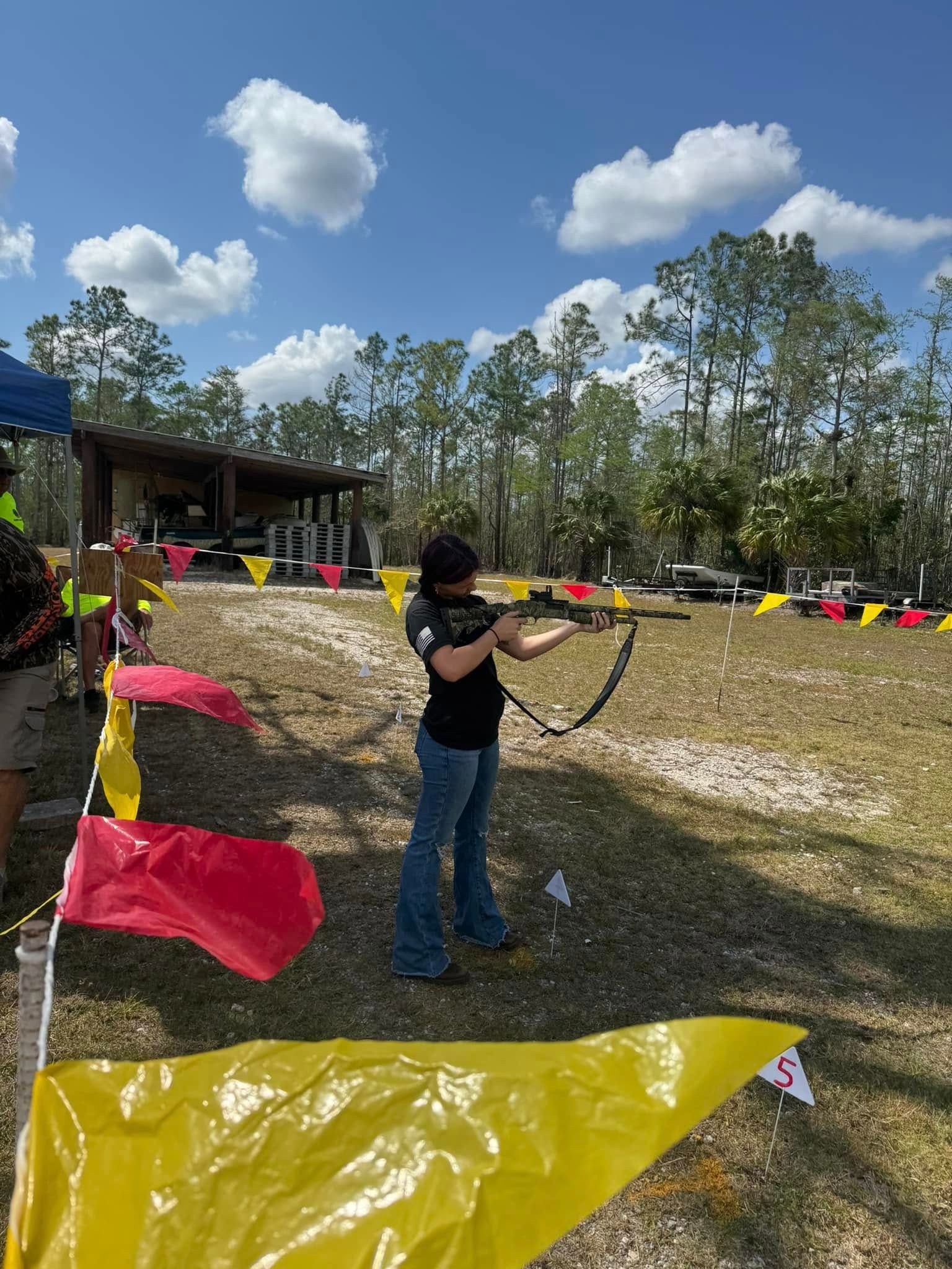 A woman shooting a gun