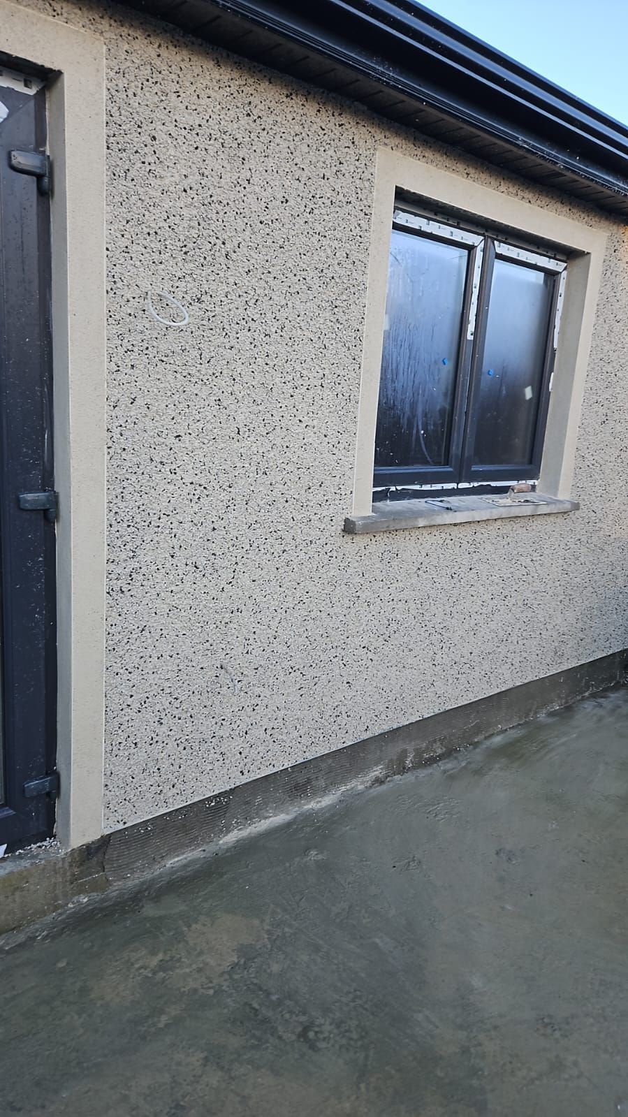 There is a window on the side of a building.