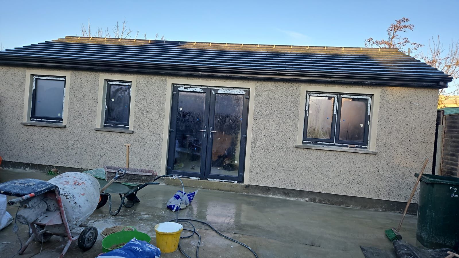 A small house with a roof that is being built.