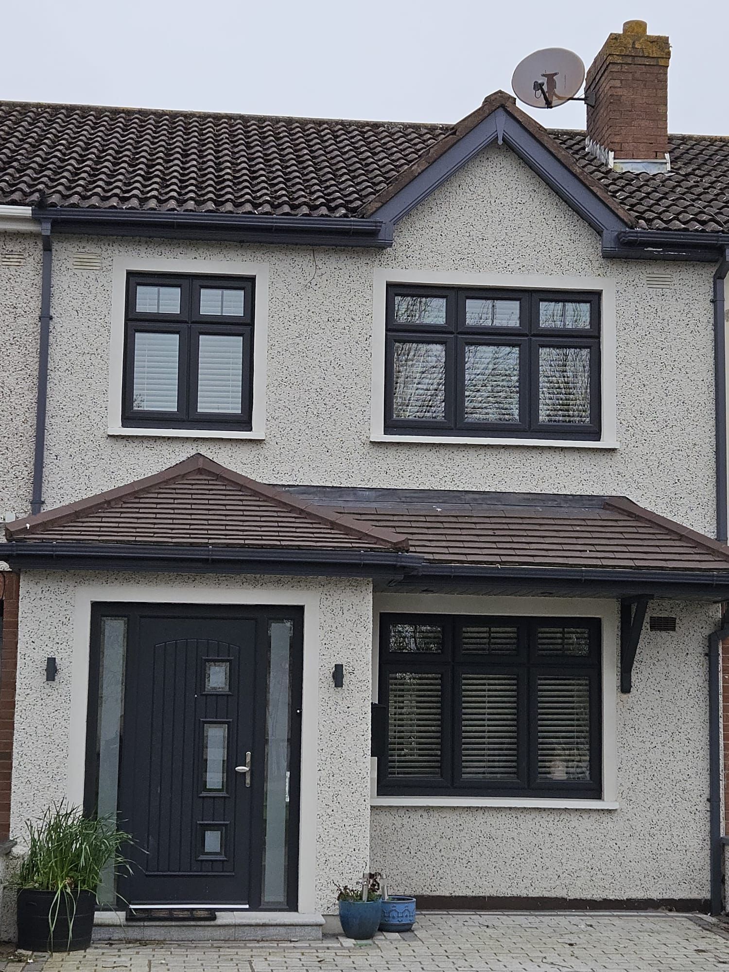 A house with a satellite dish on top of it
