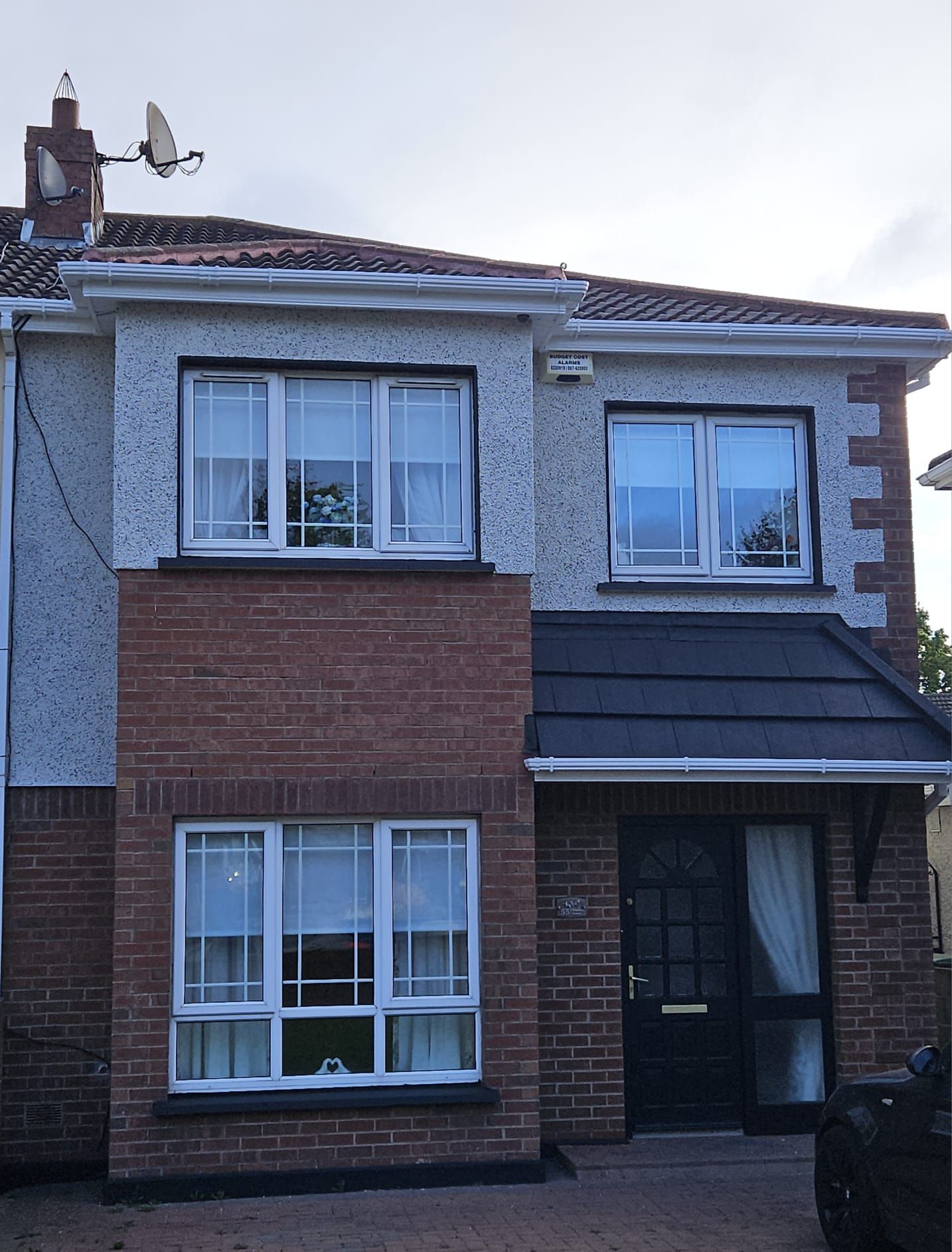 A house with a satellite dish on top of it