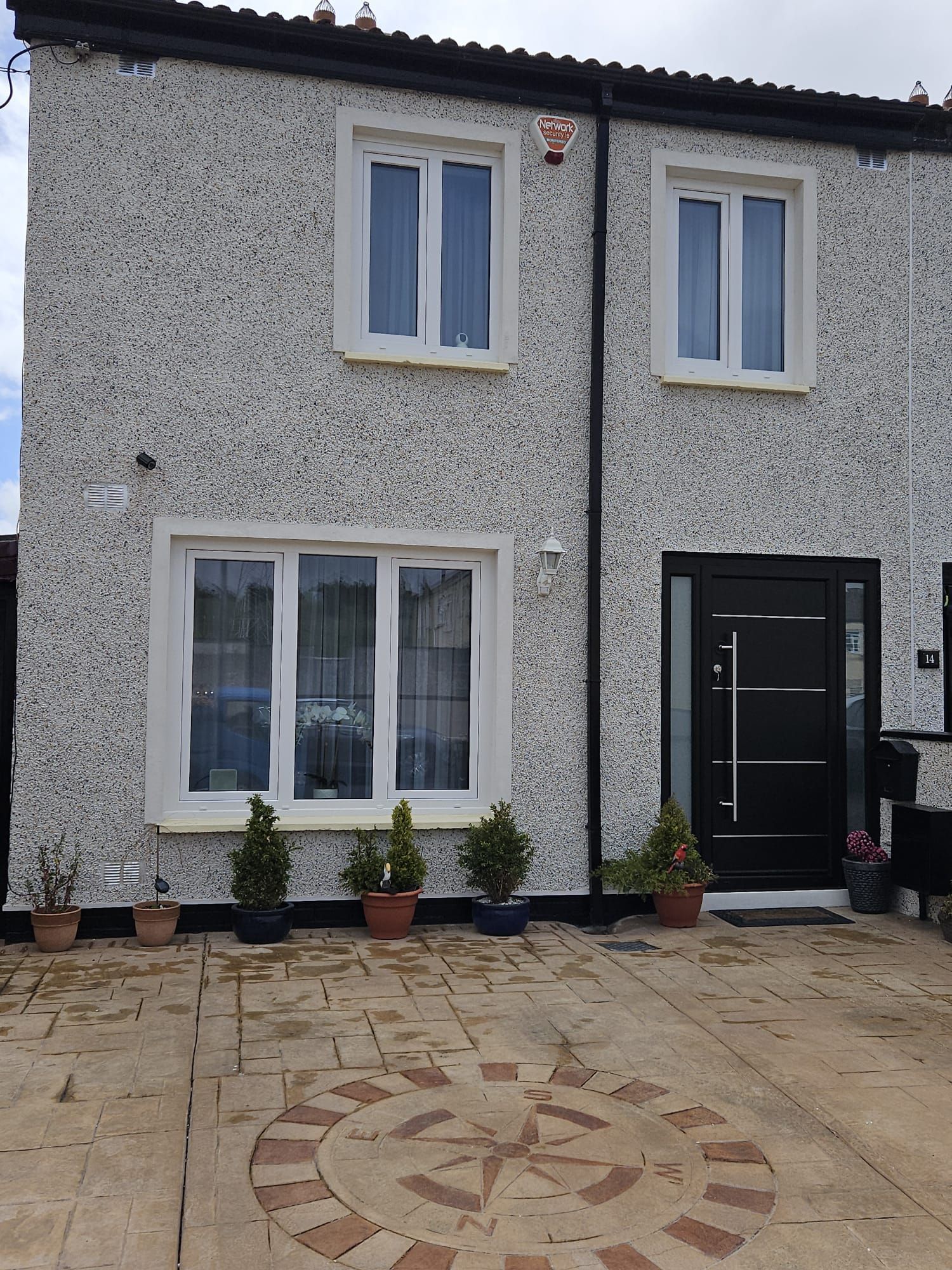 A house with a black door and white windows