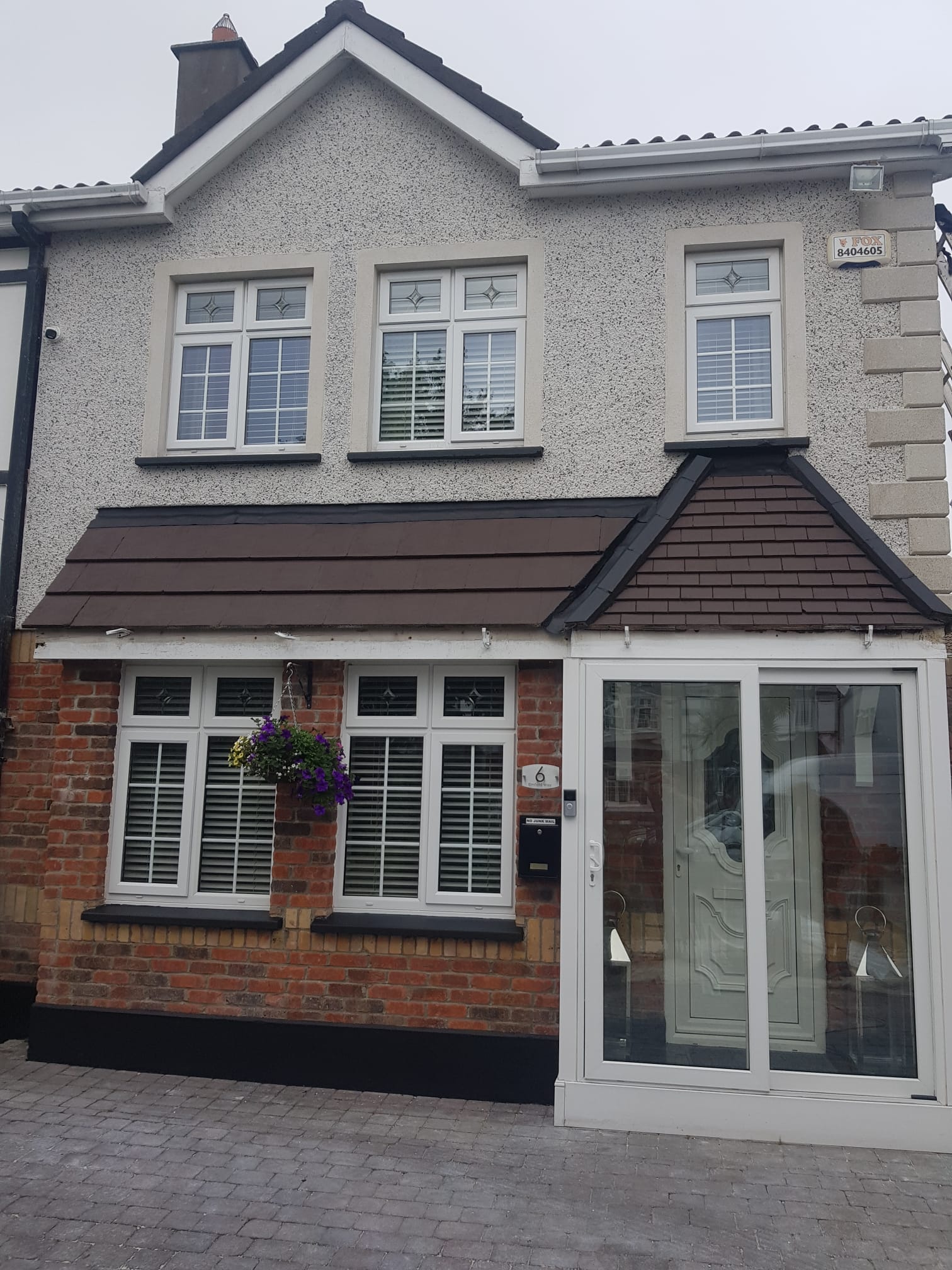 The front of a house with a sliding glass door