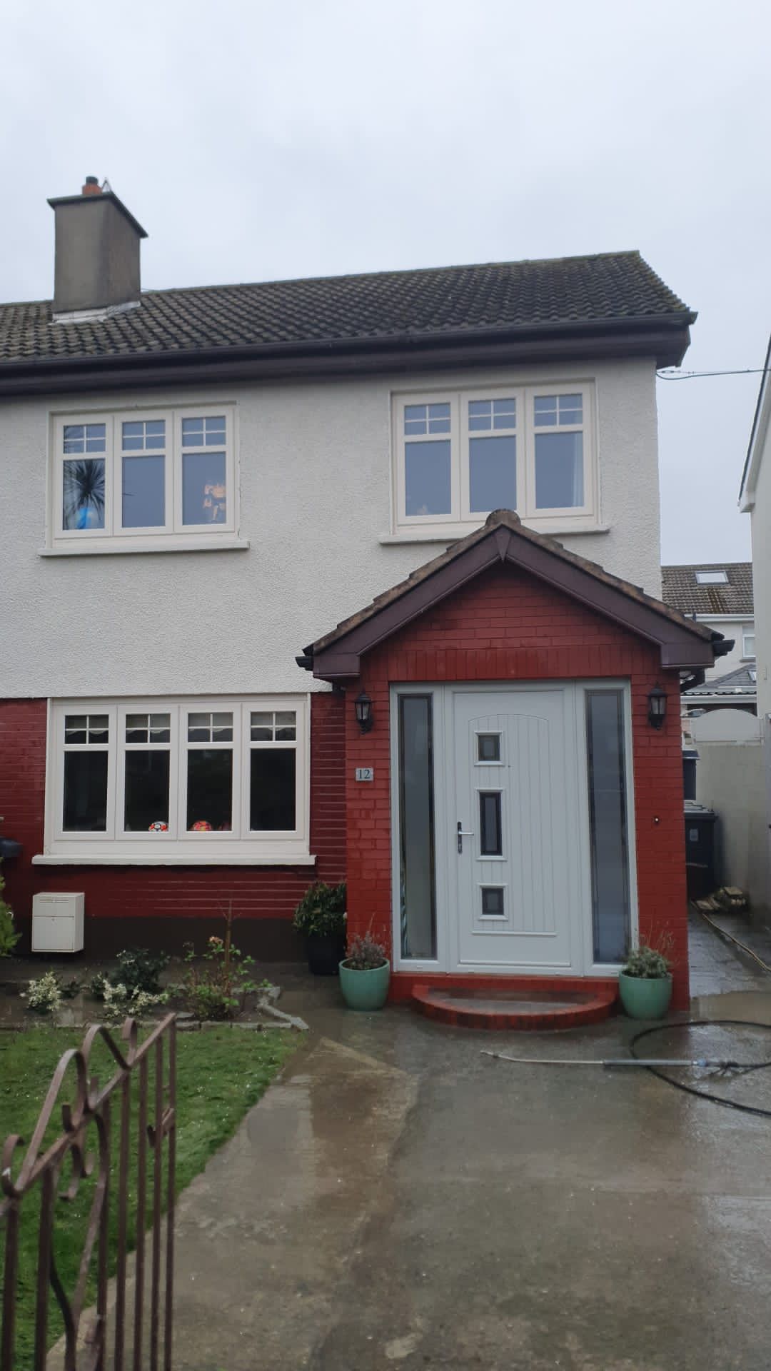 A red and white house with a white door