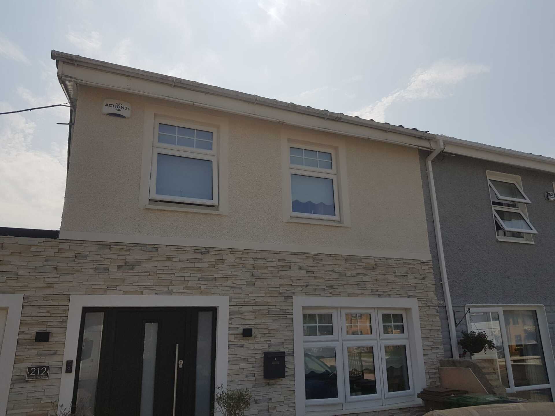A house with a garage and a lot of windows
