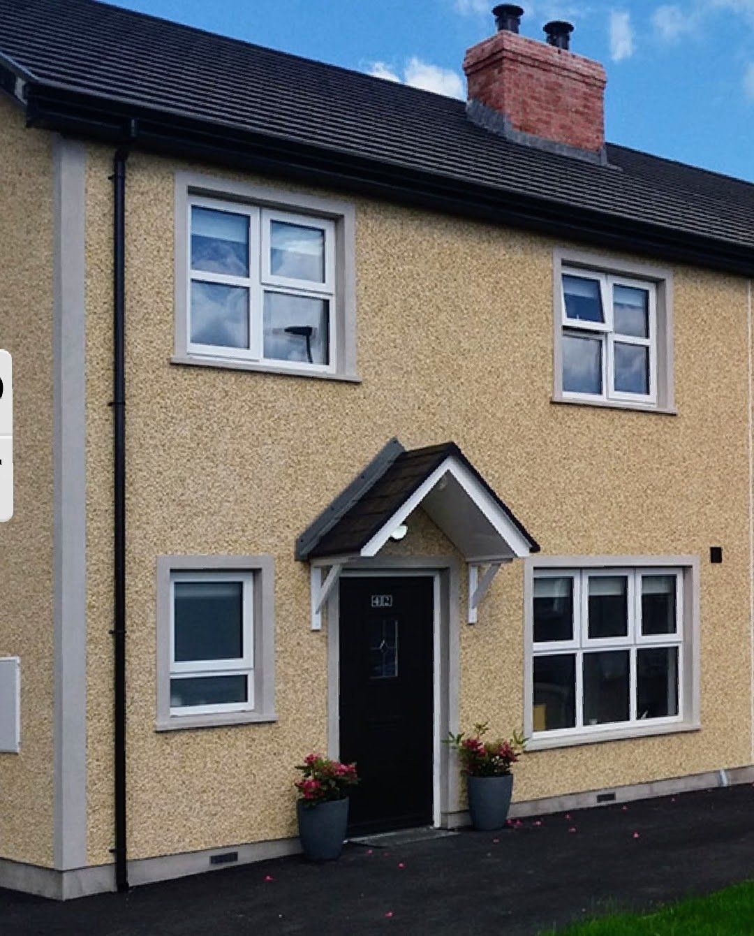 A house with a sign that says ' for sale ' on it