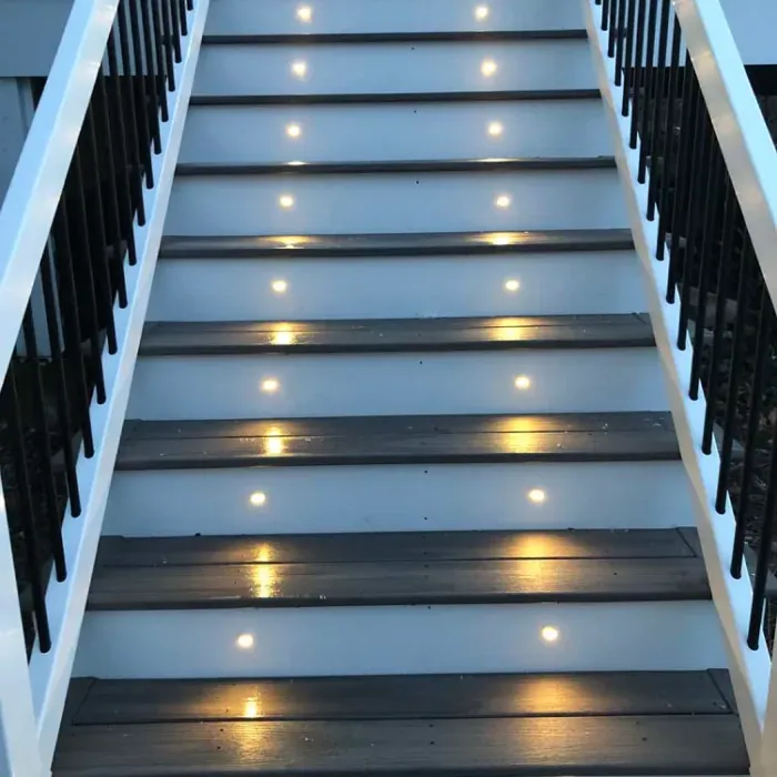 A set of stairs with lights on the steps