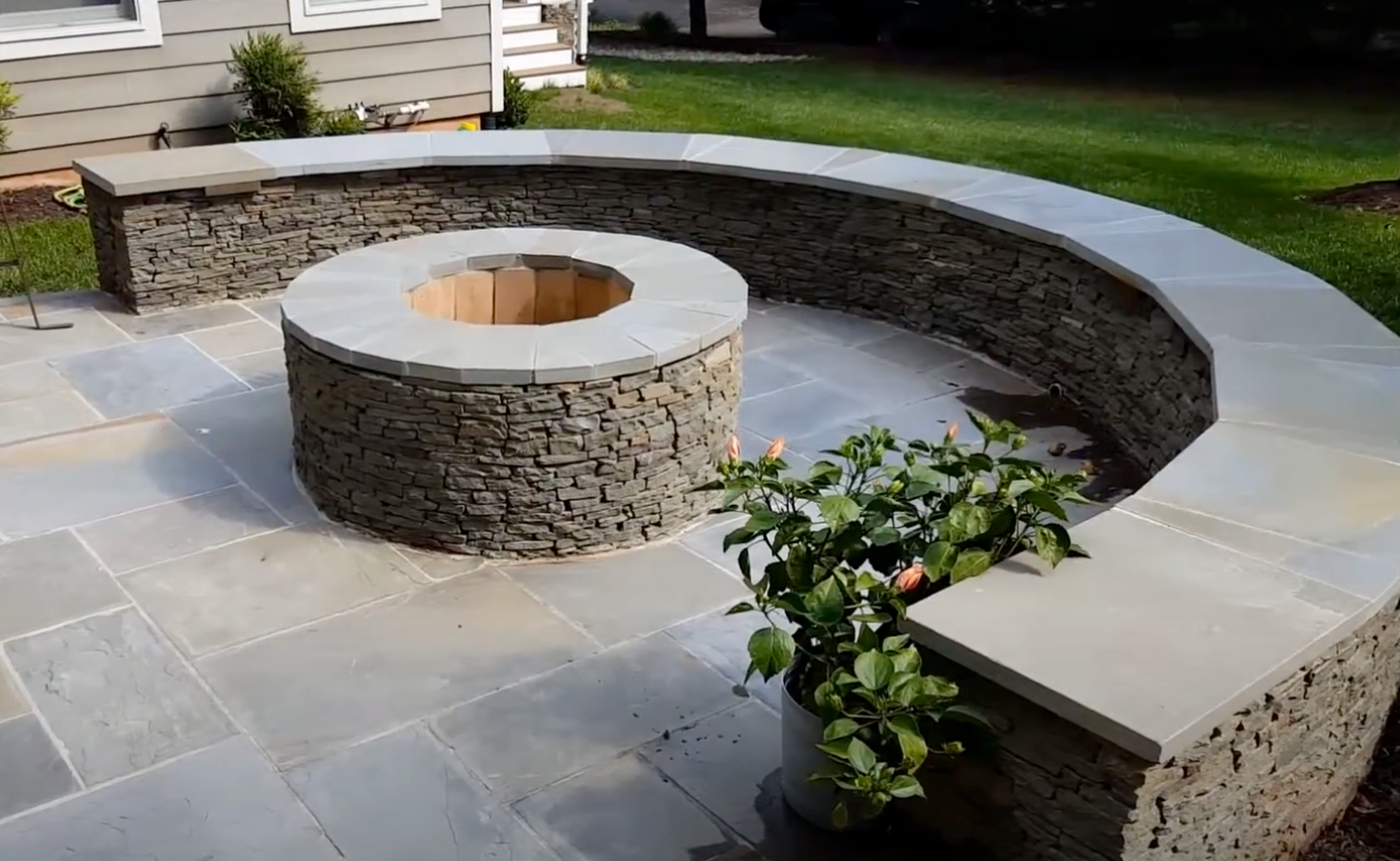 seating wall curved around a fire pit