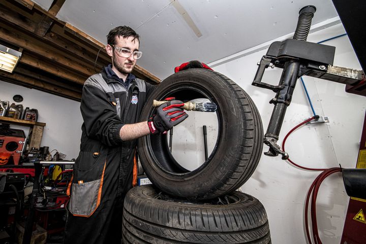mechanic with tyre