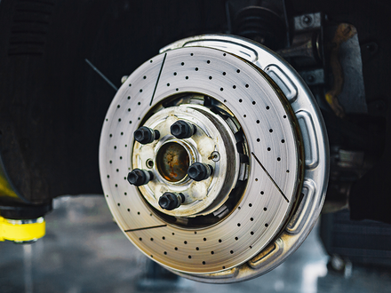 A close up of a brake disc on a car