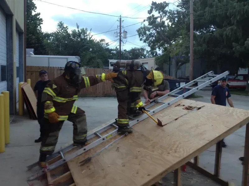 A group of firefighters are training on roof ventilation.