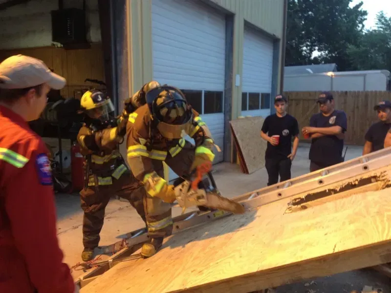 A group of firefighters are working on a ramp
