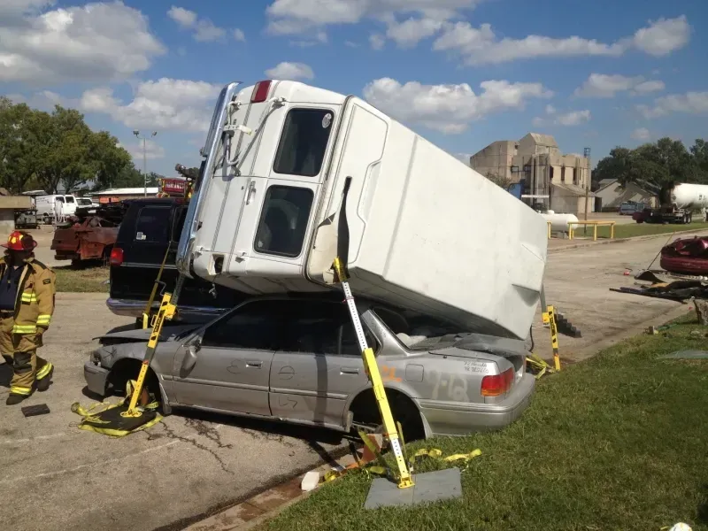 A car with a trailer on top of it