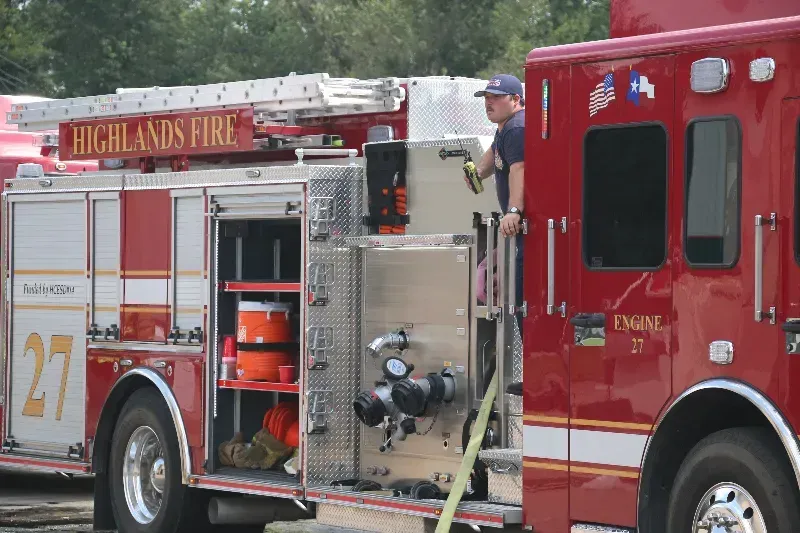 Two highlands fire trucks are parked next to each other
