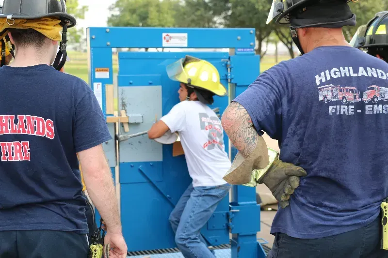 A man wearing a blue shirt that says highlands fire and rescue