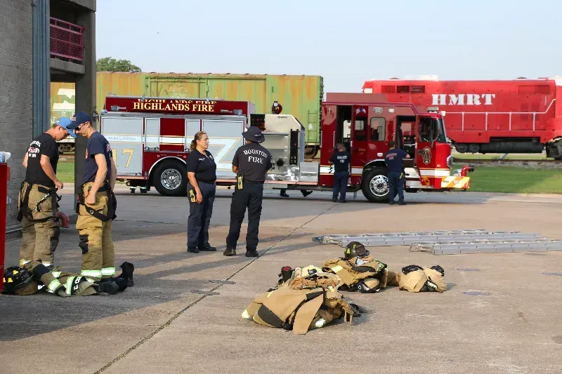 a group of firefighters are resting during a training exercise.