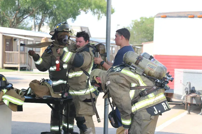 A group of firefighters are getting ready for a fire