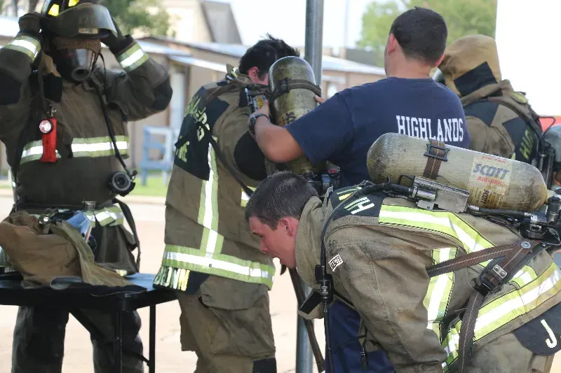 A group of firefighters are getting ready for a fire