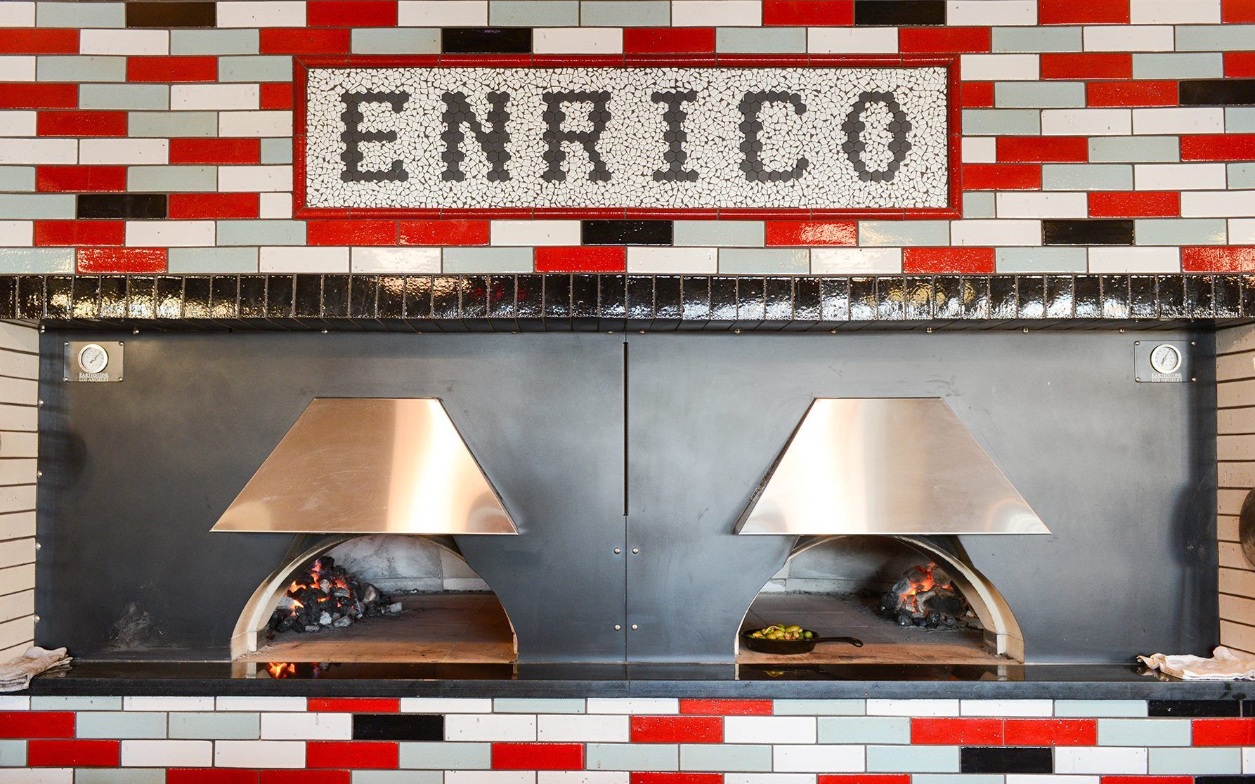 A brick wall with the word enrico on it
