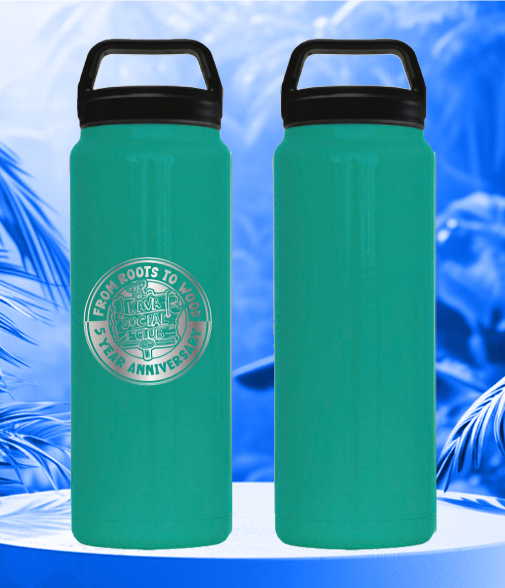 Two green water bottles are sitting on a table with palm trees in the background.