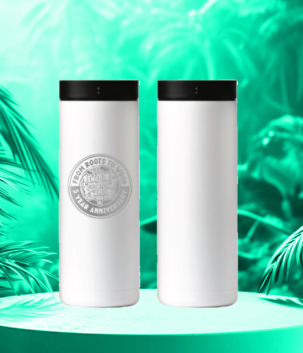 Two white bottles with a seal on them are sitting on a green table.