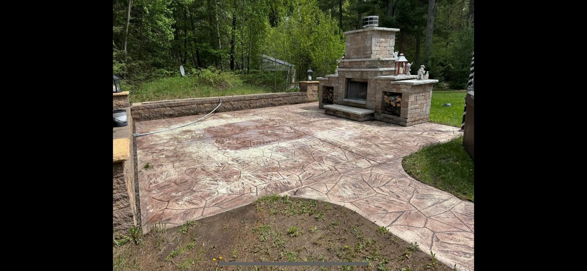 There is a fireplace in the middle of the patio.
