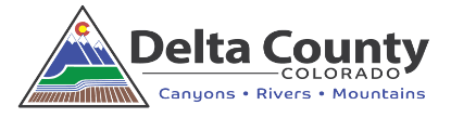 A delta county colorado logo with a mountain in the middle